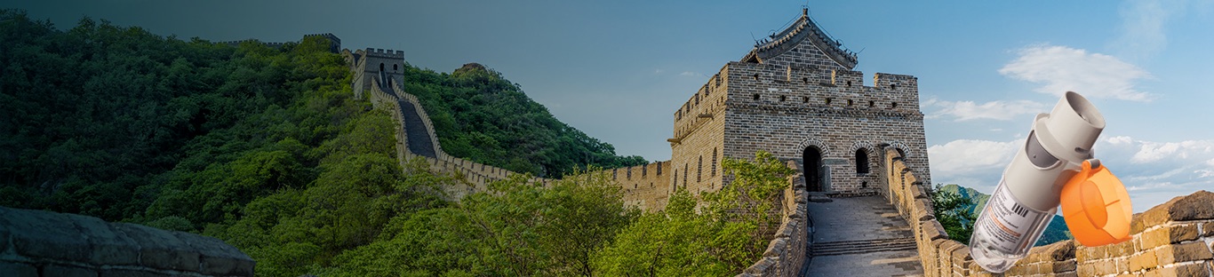 A section of the Great Wall of China with a COMBIVENT RESPIMAT inhaler superimposed on it